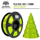 SpoolSpider Apple Green PLA Silk 3D printer filament spool, 1kg, 1.75mm, with a matching printed Christmas tree.