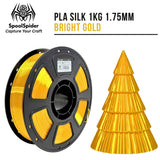 SpoolSpider Bright Gold PLA Silk 3D printer filament spool, 1kg, 1.75mm, with a matching printed Christmas tree.