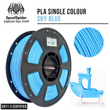 A spool of PLA single-color 3D printer filament in sky blue, shown alongside a circular close-up of the filament texture and a small blue printed boat model. The brand SpoolSpider is visible at the top left, with text reading 'PLA SINGLE COLOUR SKY BLUE' and 'EN71-3 CERTIFIED'.